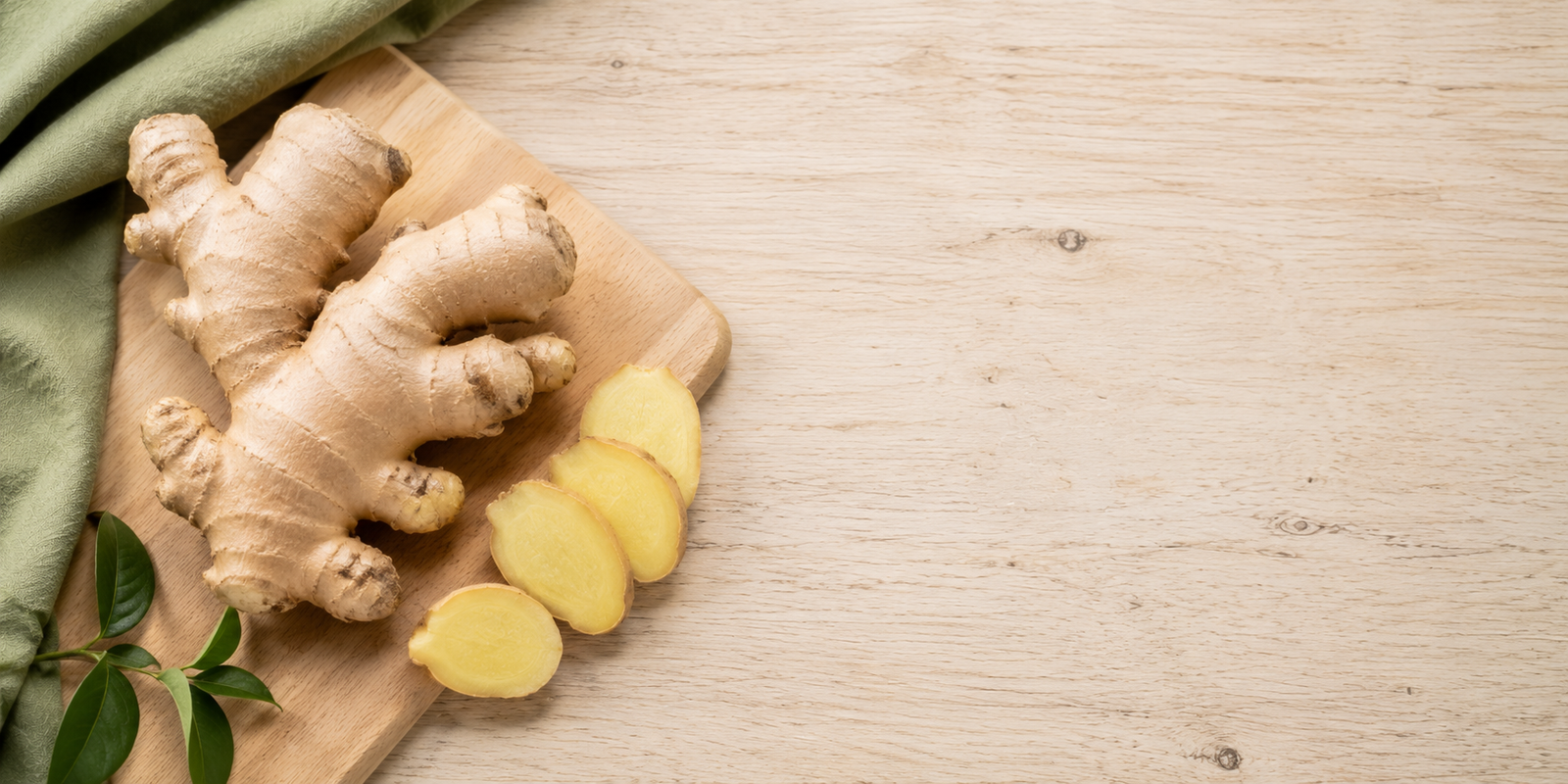 Fresh ginger root on a wooden board